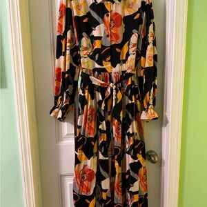 Beautiful belted floral boutique dress with pleated skirt detail.